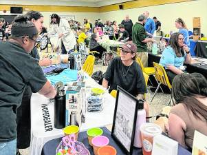 Visitors check out booths at the Wellness Family Festival.