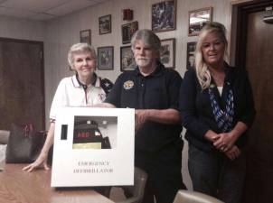 Pictured here with the new defibrillator are, from left, Elks Social and Community Welfare Chairperson Barbara Doster, president of West Milford First Aid Squad Ken Cuneo and Elks Exalted Ruler Tammy Roos.