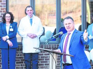 Hackensack Meridian Health President and CEO Mark Sparta speaks at the podium.