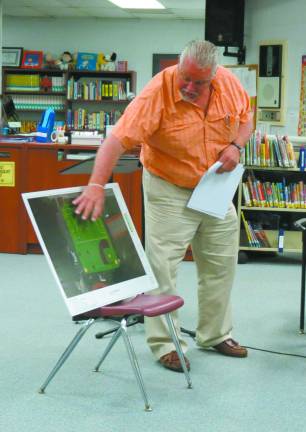 Photo by Patricia Keller Bill Hemstead, of the Recreation Advisory Committee, presented the group's proposal for a second artificial turf field to the school board recently.