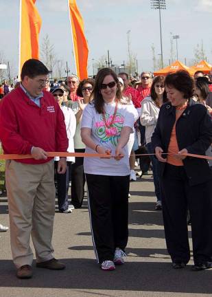 Lyndsay Wright of West Milford cut the ribbon to being the 2012 Walk MS event in Ridgefield last Sunday. Her team raised over $1,000 for MS research.