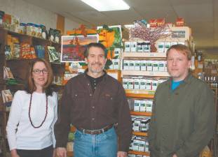 File photo by Ginny Raue Sally and John Malatras, shown in 2014, have owned and operated Harvest Moon Health &amp; Nutrition in West Milford for two decades. They are planning to retire. The man at right is Steve Keil, who was the store/supply manager at that time.