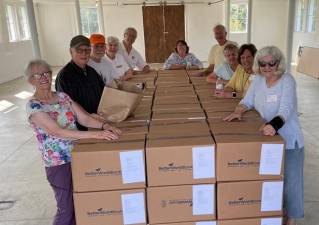 The Friends after the Book Sale boxing up the unsold books – 150 boxes in all! The unsold items were then donated to Better World Books.