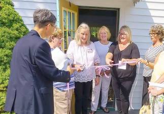 On Wednesday, Sept. 15, the opening of Aunt Jenny’s Attic, a thrift shop in the West Milford Presbyterian Church’s Parish House, was celebrated with a ribbon-cutting ceremony. The shop is named after Aunt Jenny Baker, who organized the first rummage sale at the West Milford Presbyterian Church in 1954. Pictured from left to right are: Pastor Justin Choi, Karen Wilmont, Linda Fredricksen, Pat Wright, Mayor Michele Dale and Pam McGlashen. Photo by Donald Wright.