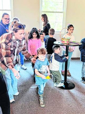 Theo Scheichet, 4, of West Milford carries an Easter egg.