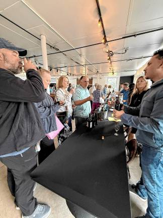 Guests at a Harvest Wine Tasting fundraiser Saturday, Sept. 6 at the Wallisch Homestead. (Photos by Denise von Wilke)