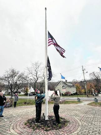 The flag is raised at the ceremony.