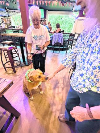 Phoenix gets a treat from a fundraiser raiser attendee.