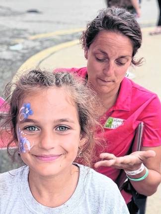 Arianna Muno, 7, of West Milford gets her face painted.
