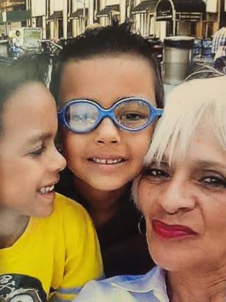 Ruth Barbosa, of Newburgh, and her grandsons, who call her Mommy. The boys are now teenagers. Barbosa is launching her own business, Spirit Care, to mentor people who are struggling to overcome trauma.