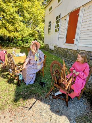 Women demonstrate crafts of the Victorian era.