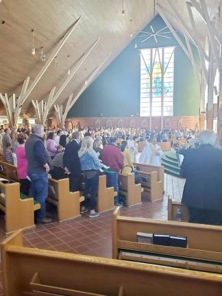 Part of the celebration of Easter is the renewal of Baptism. Fr. Jack Arlotta of St. Stephen the First Martyr Church in Warwick sprinkled water throughout the congregation on Easter Sunday as part of that renewal ceremony.