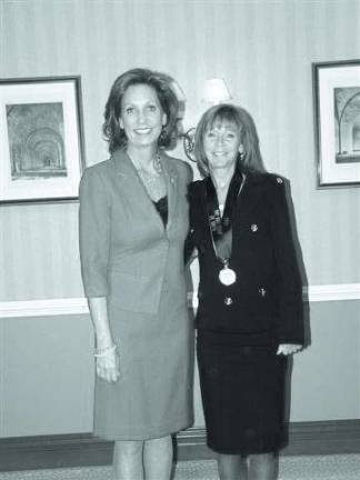 Linda McCullough, right, is pictured with Margaret Kelly, CEO of RE/MAX International. McCullough is celebrating her 20th year with the company.