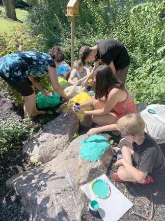 The family helped to paint and decorate the rocks that were once underneath the garden.