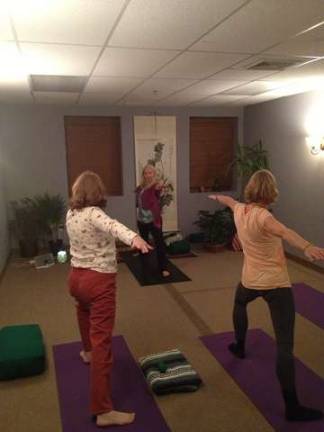 Sara Gallmann, a certified yoga instructor, leads a class at West Milford Physical Therapy.