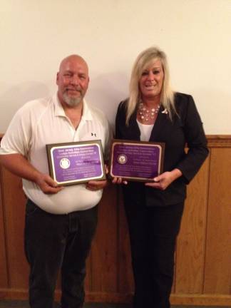 Exalted Ruler, Rich “Otis” Asmus and Esquire Tammy Roos displaying the two awards.