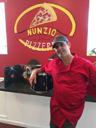 Photo by susan Levitt Mike Schinina learned to cook while standing at his mother's and grandmother's side and worked for a long time in pizzerias. He now is the proud owner of his own restaurant.