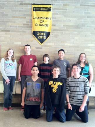 Photos provided by Ken Ryerson Some members of the winning homeroom are seen under last year's banner.