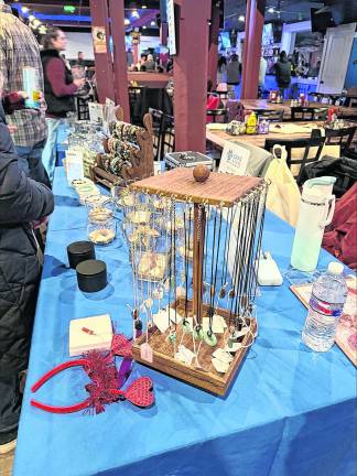 Items for auction are displayed on a table.