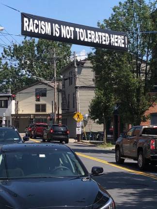 A banner over West Street. After receiving calls about a pro-police banner, the Village of Warwick is considering limiting banners to local event promotion to avoid a banner war.