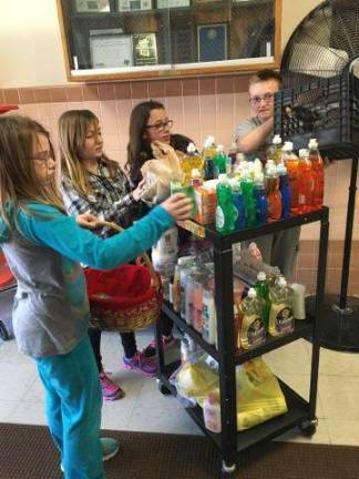Paradise Knoll students are seen here collecting the donations.