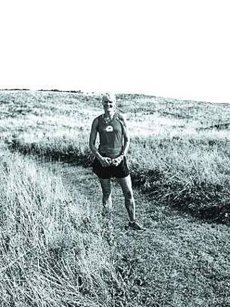 Sue Muhaw loves running on trails as well as marathons. This photo of her was taken last summer at Block Island in Rhode Island She was a few hundred feet from the finish line last Monday at the Boston Marathon when two bombs went off nearby.