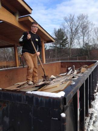 Building trades students help demolish firehouse