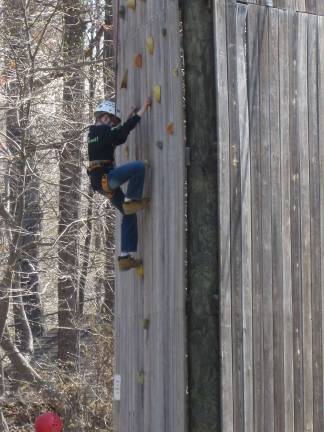 Kevin takes a climb on the rock wall tower
