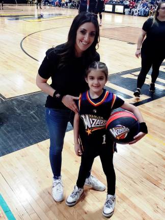 Gina Vincenti, who helped organize the game for the Paradise Knoll PTA, and her daughter Alivia, 8, were ready for the Harlem Wizards game.