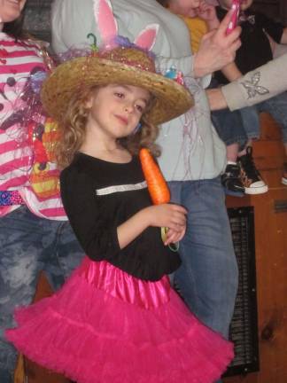 Rabbit ears, a carrot, Easter basket grass - this little girl had it all on her bonnet.