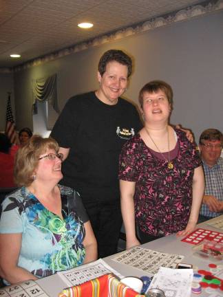 Michelle Letsche with mom Alice, left, dad John, right, and Rev. Dr. Janet Macgregor-Williams of West Milford Presbyterian Church standing.