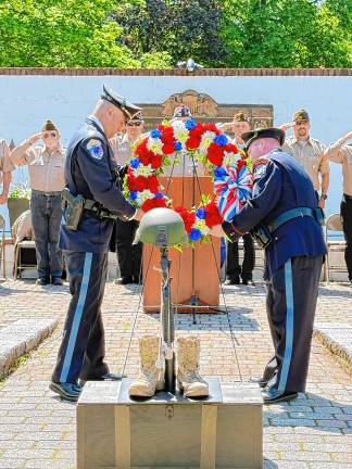 West Milford police officers place a wreath during the ceremony. (Photo by Denise von Wilke)