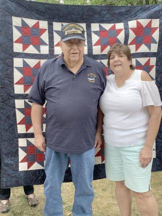 Joseph Zaccaro stands with Debbie Van Brunt, who made his Quilt of Valor.