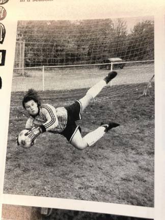 A yearbook photo shows Jen Pawol as the soccer team’s goalie.