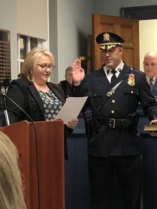 Mayor Michele Dale administers the oath of office to Police Chief Shannon Sommerville, who has been acting chief for the past few months. He succeeds James DeVore, who retired effective Jan. 1 after serving as chief for about three years.