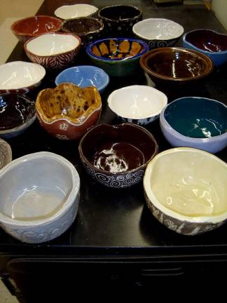 Photos provided Christa Callamari, Clifford West, Christina Ugrovics and Kayla Osborne are making their bowls for the Empty Bowls fundraiser set for March 15.