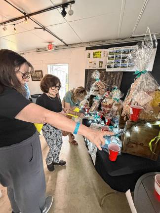 The event includes a gift basket auction.
