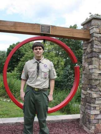 Photo by Ginny Raue Eagle Scout Michael Goceljak stands in front of his Eagle project, a restored fire ring and its new housing at West Milford Engine Co. #4 on Black Sheep Lane in West Milford. Michael chose this project in memory of his grandfather, John Goceljak, a firefighter with Co. #4 for more than 30 years and as a thank you to all volunteer firefighters.