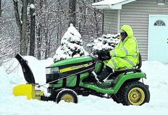 An area man plows his driveway after about 5 inches of swow fell on West Milford on Friday and Saturday.