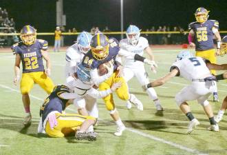 During a game from the 2019 season, Vernon running back John Rosado moved the ball forward with Sparta defenders in hot pursuit.