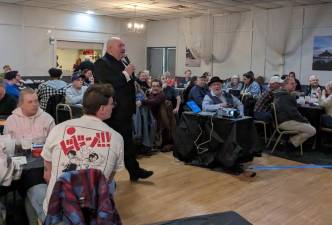 Tony Donato leads the group during Trivia Night at The Elks Lodge.