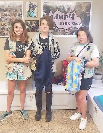 Girl Scouts Emma Morgan, Gretchen Ileczko, and Zoe Lisbona donated the blankets to the shelter last year.
