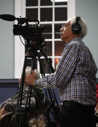 Volunteer cameraman Geoff Belinfante is seen here filming a township council meeting.