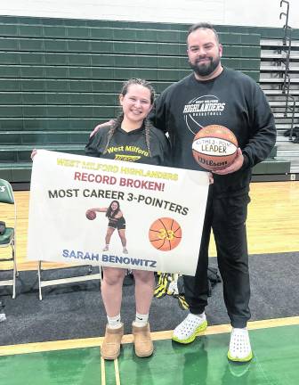 High school senior and varsity basketball captain Sarah Benowitz set a new school record during Wednesday night’s game, celebrated alongside her coach.