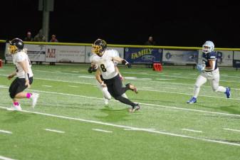 West Milford ball carrier Chase Tyburczy is on the run in the first half of the game against Sparta on Friday, Oct. 13. The Highlanders lost, 41-20. (Photo by George Leroy Hunter)