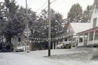 The Flying A, one of the gas stations on Union Valley Road in West Milford Village, is visible in this 1950s photo. The station was located across the road from the West Milford Presbyterian Church property. Photo by Ann Genader.