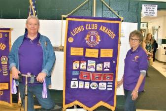 Charles Chuck Enering, left, at the Lions Club Health fair in April 2019.