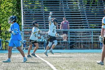 The West Milford High School boys lacrosse team plays Wayne Valley in the Passaic County Tournament final May 10. The Highlanders lost, 10-8. (File photo by Jack Lizza)
