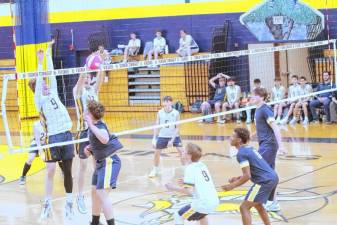 <b>The Vikings and Falcons battle on the volleyball court Wednesday, April 23. Vernon won, 2-1. (Photos by George Leroy Hunter)</b>