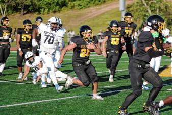 WF1 West Milford running back Jeffrey Papienuk carries the ball in the season opener against Paramus on Thursday, Aug. 28. The Highlanders won, 44-13. Papienuk rushed for 119 yards and made one touchdown. (Photo by George Leroy Hunter)